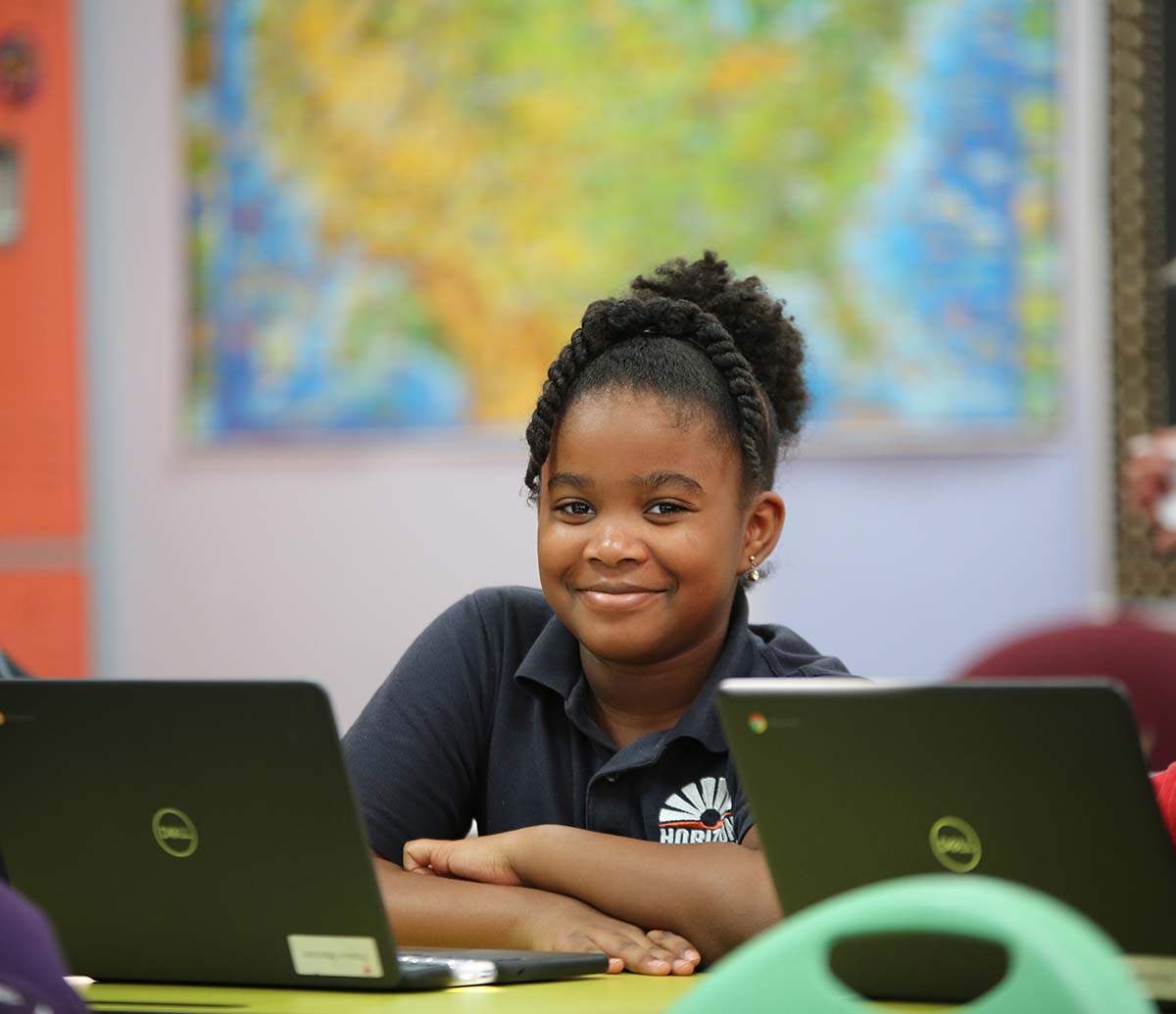 Teacher or school staff member warmly interacting with a student outside